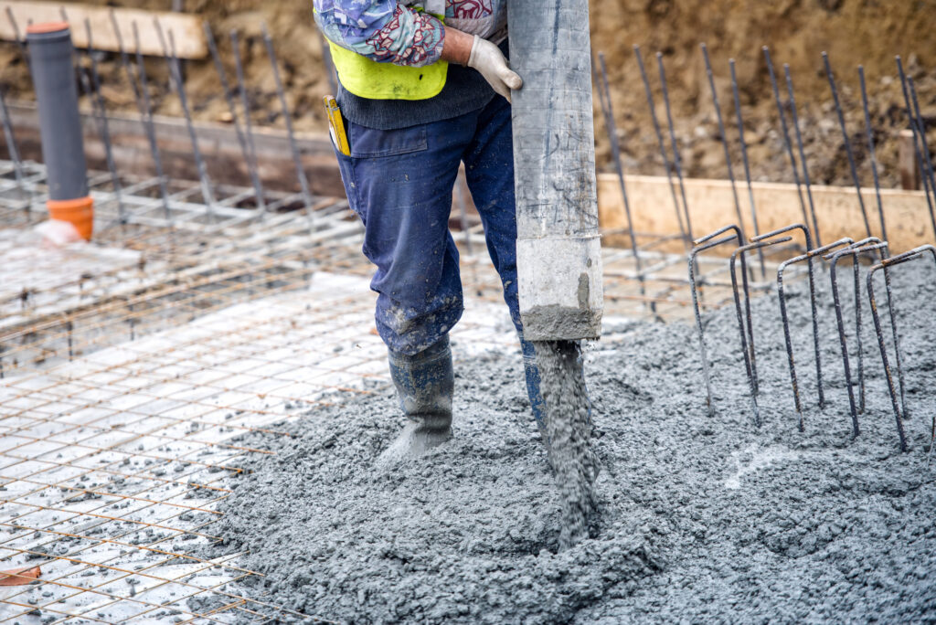 construction worker pouring ce